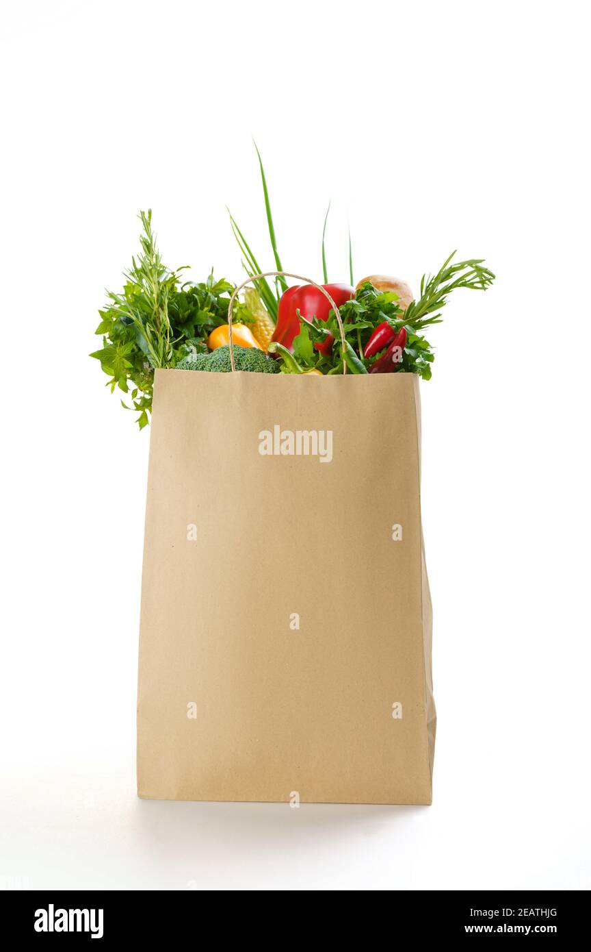 Fresh vegetables and fruits in paper bag Stock Photo