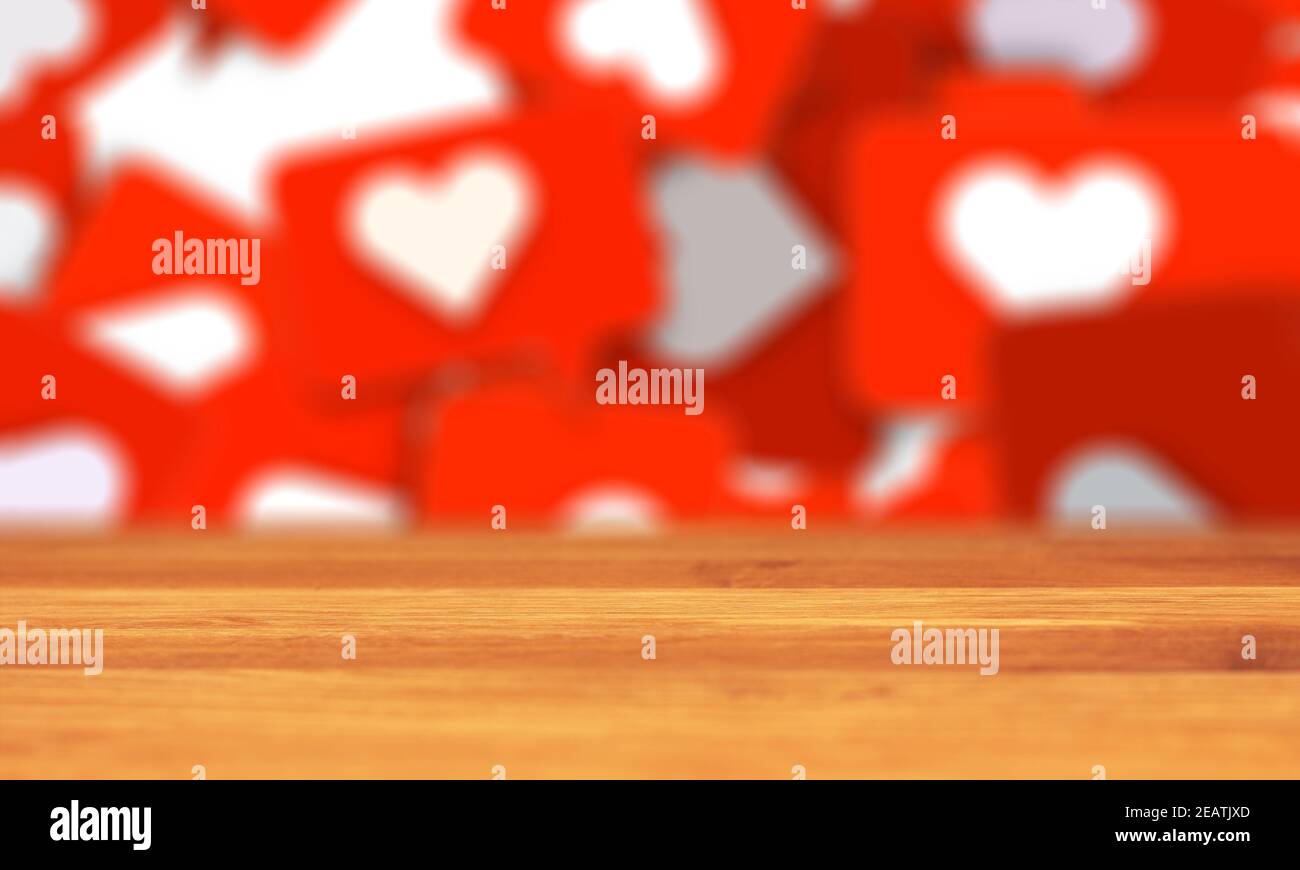 empty wooden table social media network love and like heart symbol background in red. Stock Photo