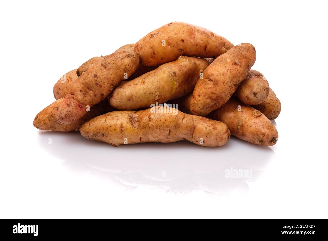 Raw bamberger hÃ¶rnle potatoes on white Stock Photo