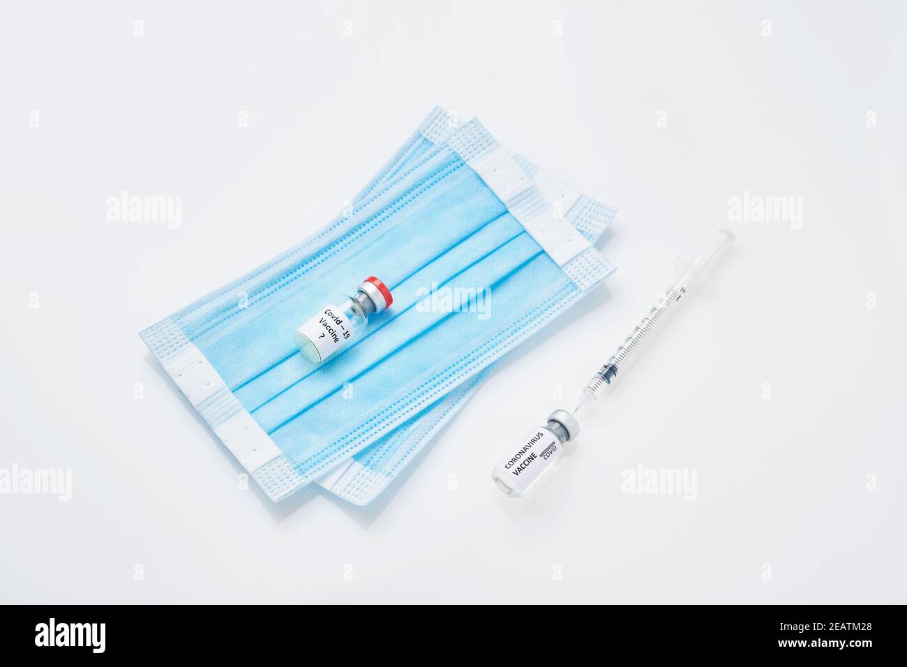 Coronavirus prevention vaccine, medical protective mask isolated on white background. Disposable surgical face mask cover mouth and nose. Healthcare m Stock Photo