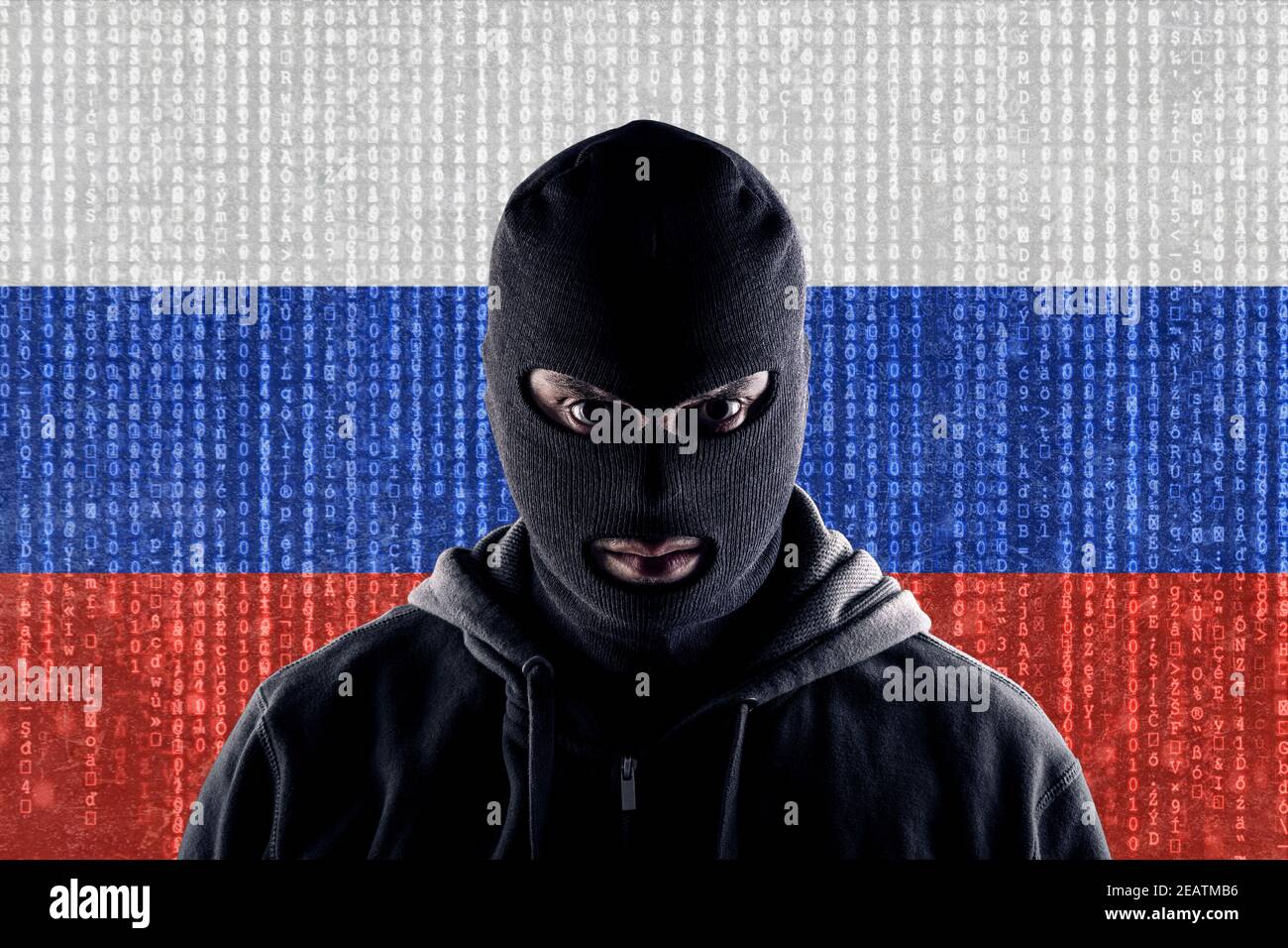Russian masked computer hacker with black balaclava Stock Photo