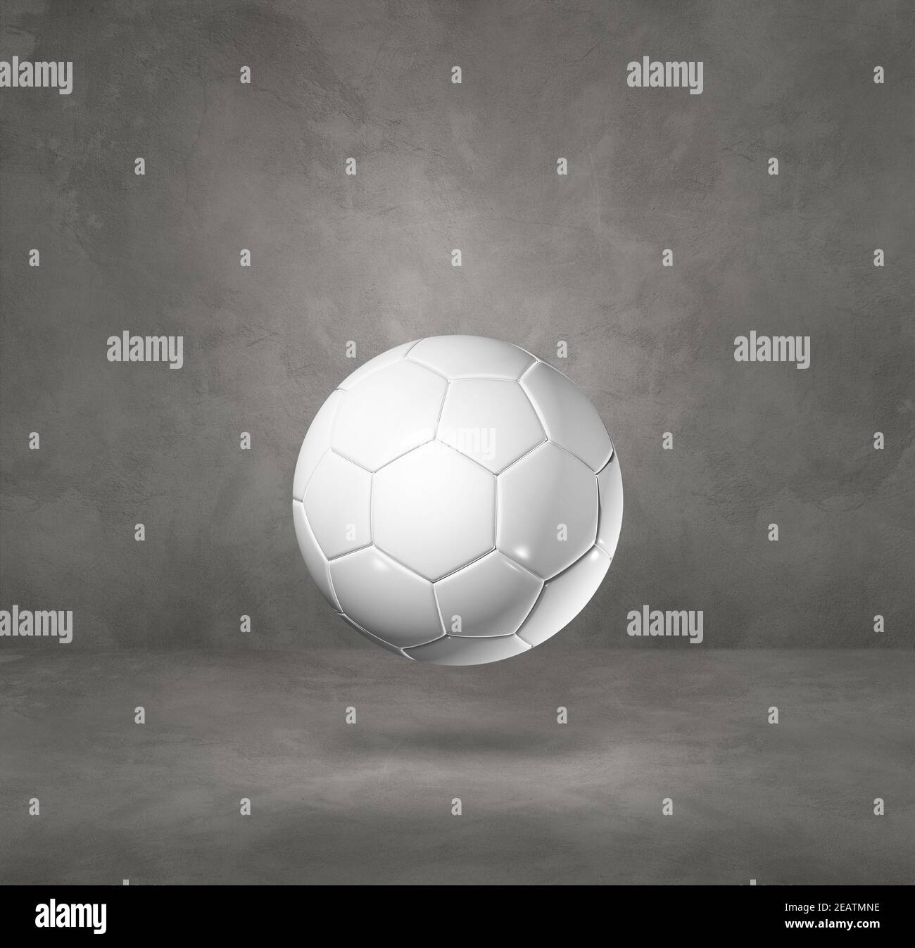 White soccer ball on a concrete studio background Stock Photo - Alamy