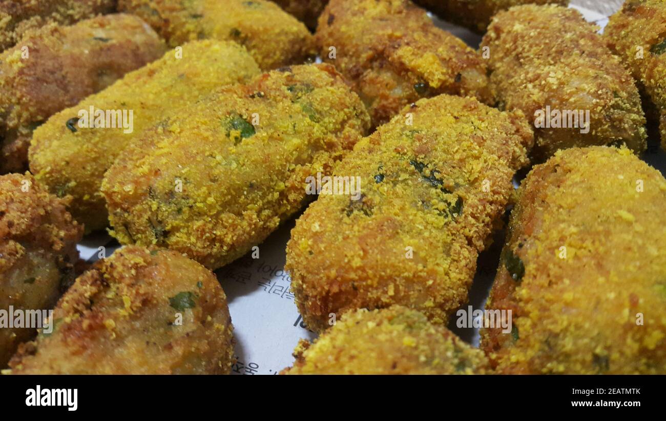 Spicy and delicious fried croquettes with a closeup perspective view Stock Photo
