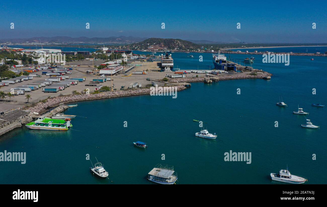 Aerial view of the sea water on the jetty and sport fishing boats in