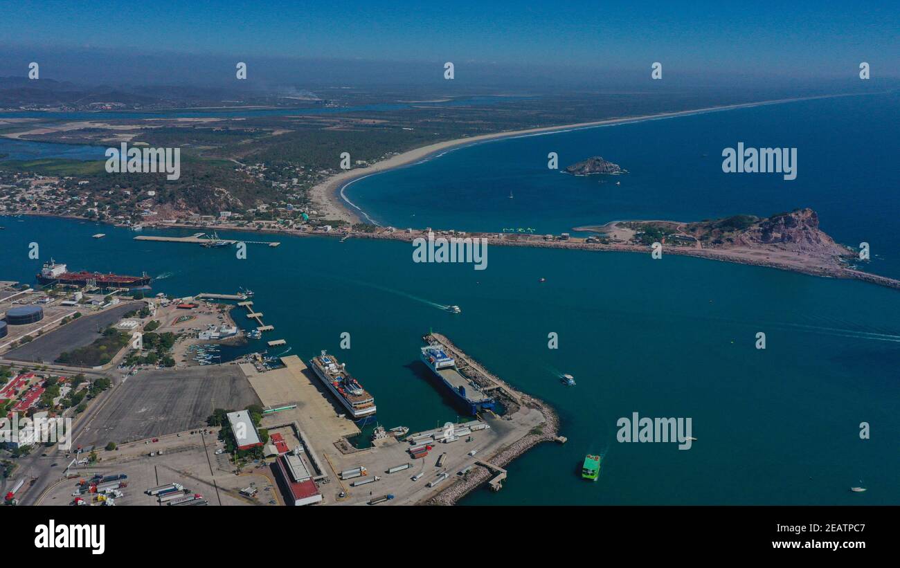 Aerial view of the maritime port, jetty and boats in the sea water in