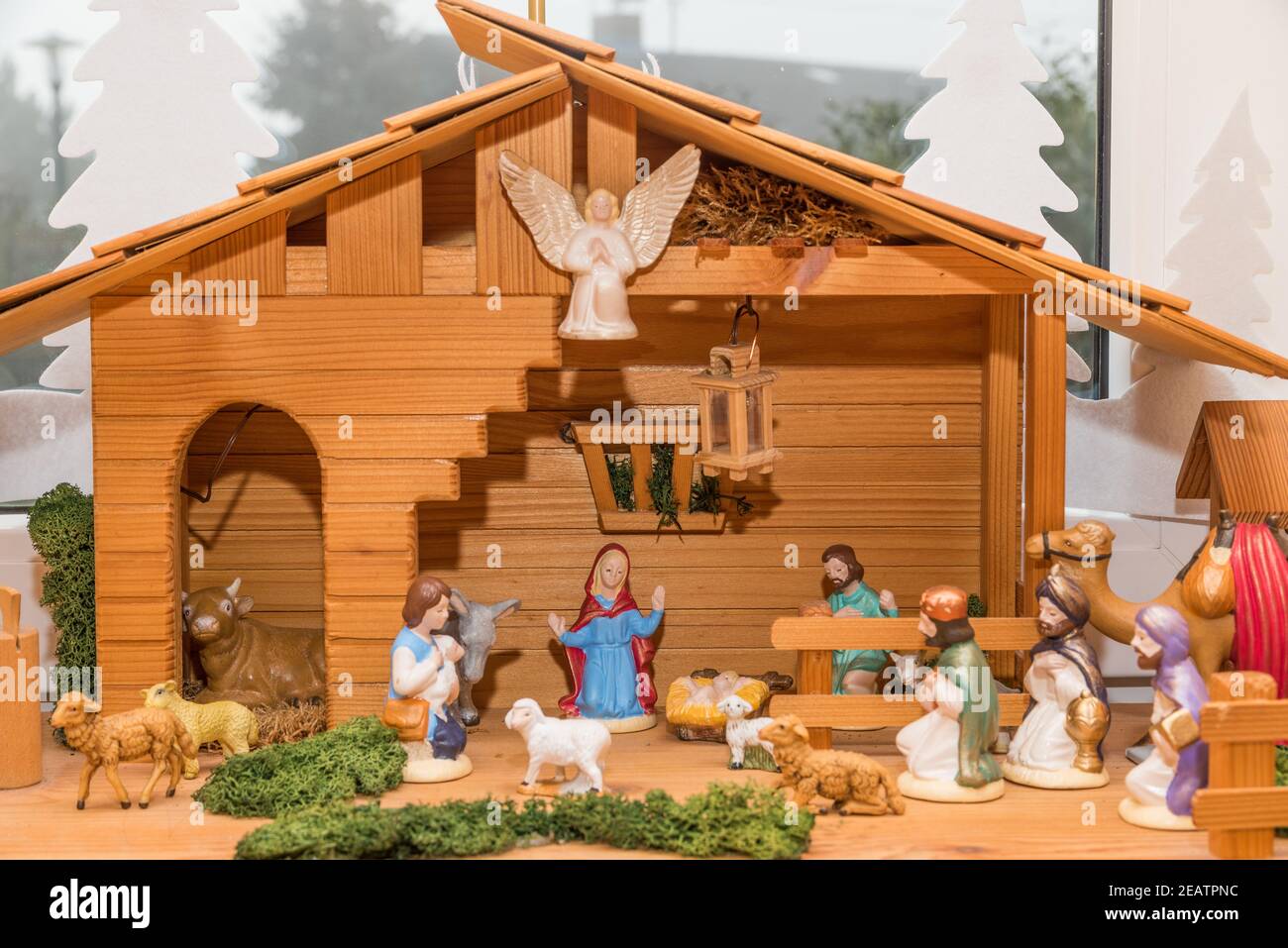 Wooden crib with painted crib figures Stock Photo
