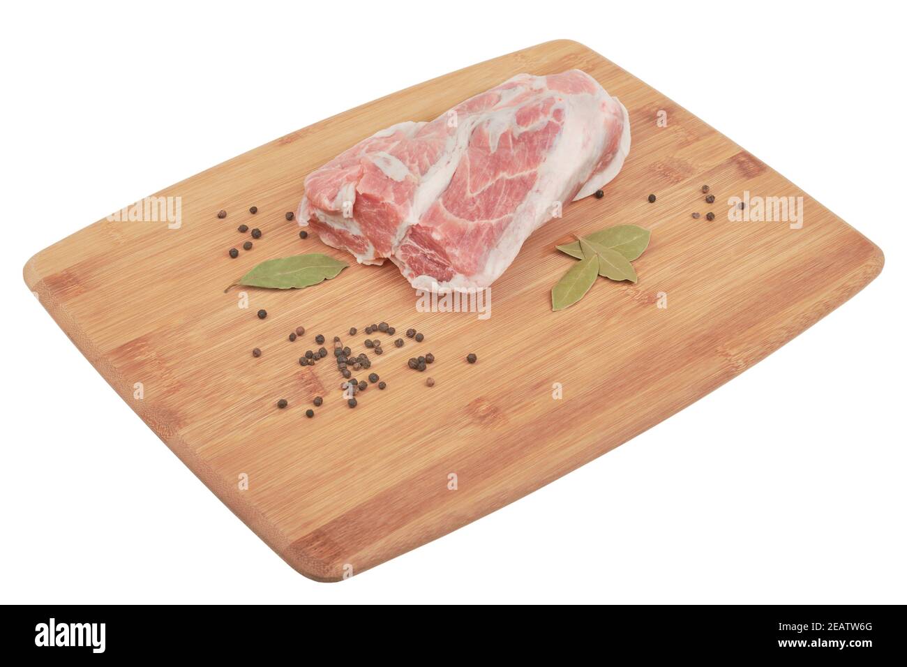 Pork neck with pepper and bay leaf on a wooden board isolated on white background. Photo of raw meat, cookery Stock Photo