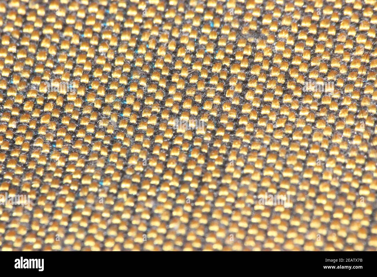 macro photo as background close up of golden color cloth fibers Stock Photo