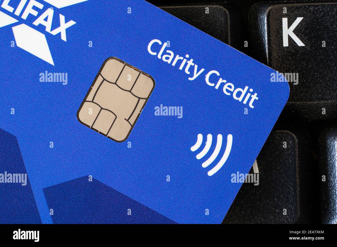 Closeup on a Halifax Clarity Card - a UK credit card showing a chip and the logo for contactless payment. Theme: chip and pin, debt, cashless payment Stock Photo