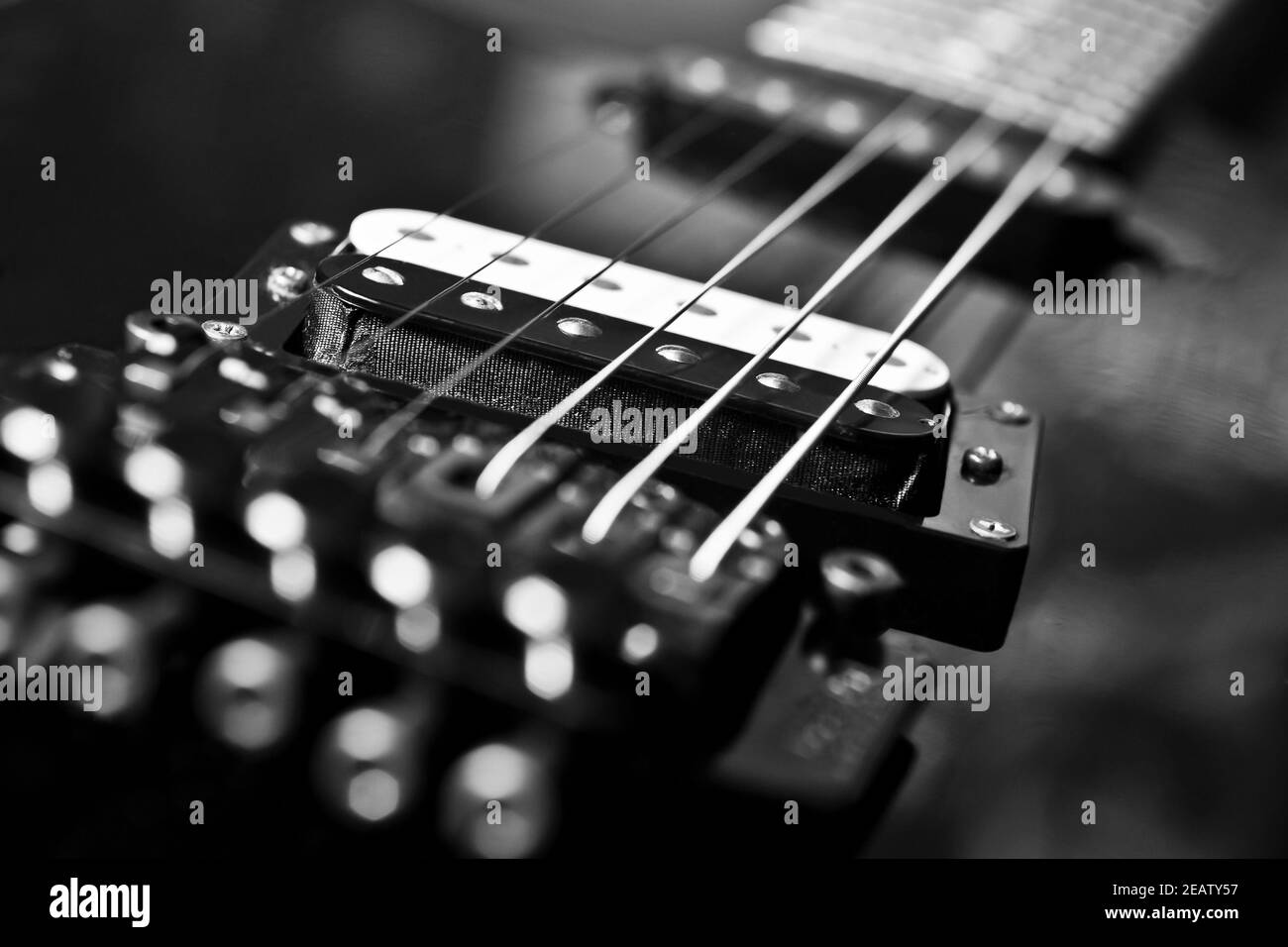 Strings electric guitar closeup in black tones Stock Photo