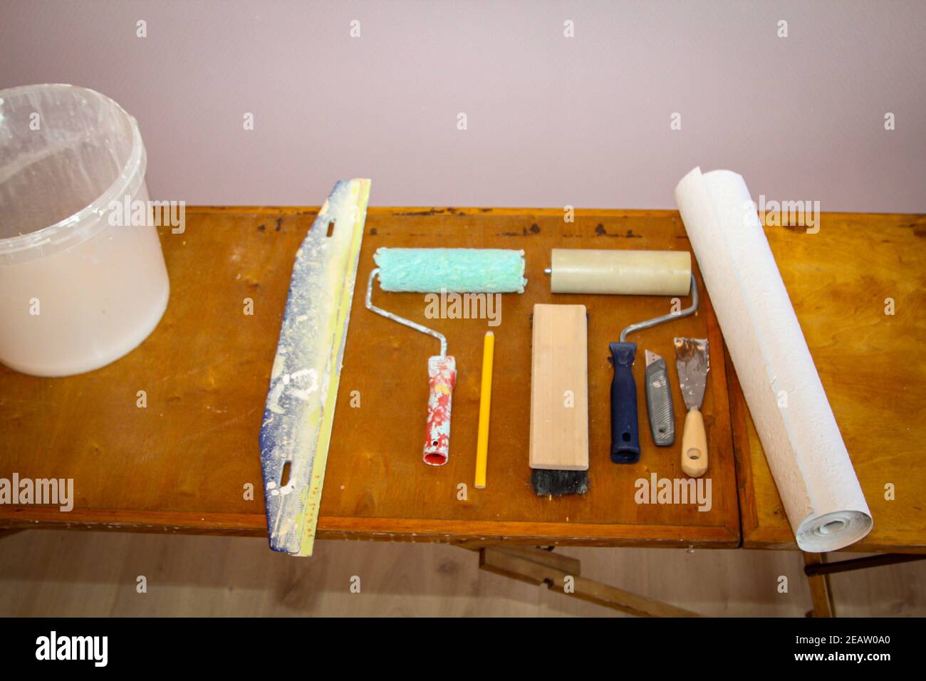 Painter and wallpapering utensils and details of a wallpaper board