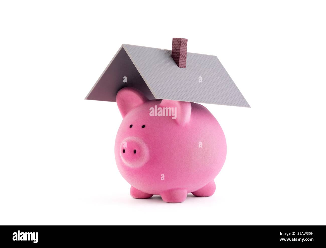 Piggy bank with house roof on white background with clipping path Stock Photo