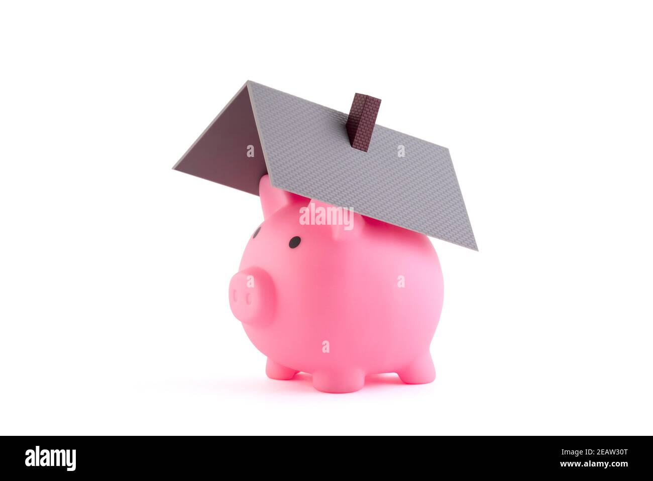 Piggy bank with house roof on white background with clipping path Stock Photo
