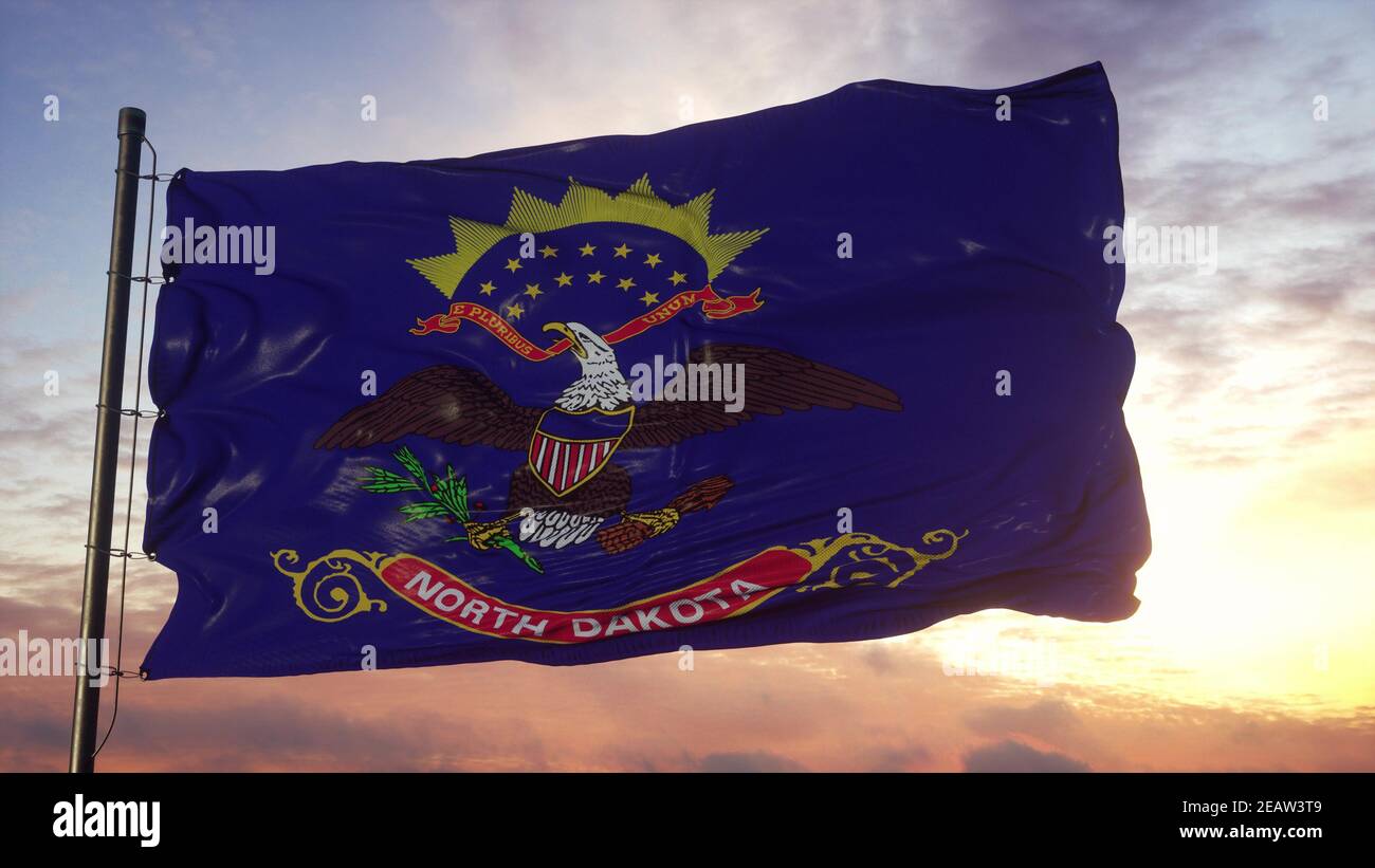 Flag of North Dakota waving in the wind against deep beautiful sky. 3d ...