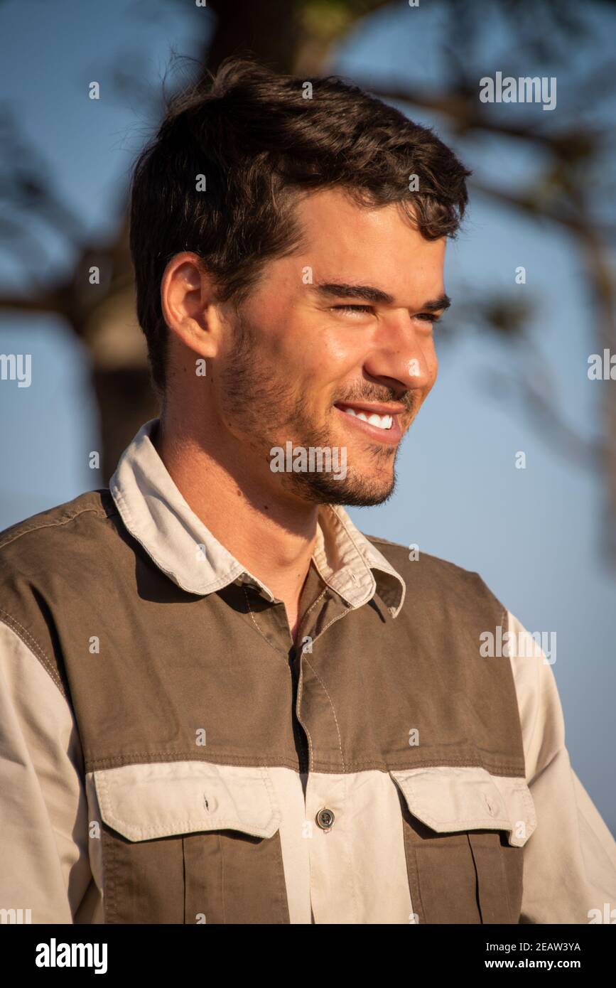 Close-up of smiling safari guide in sunshine Stock Photo