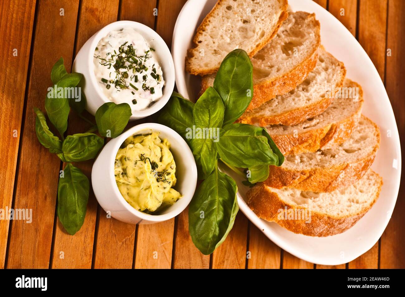 Frisches Brot mit KrÃ¤uterbutter und KrÃ¤uterquark Stock Photo