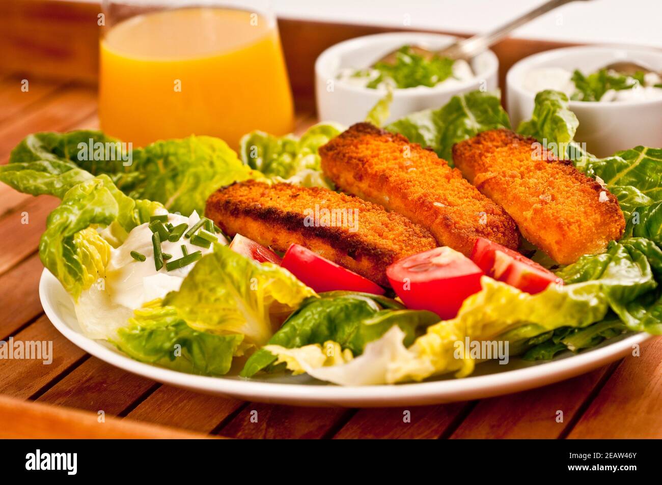 Fish fingers served with salad Stock Photo