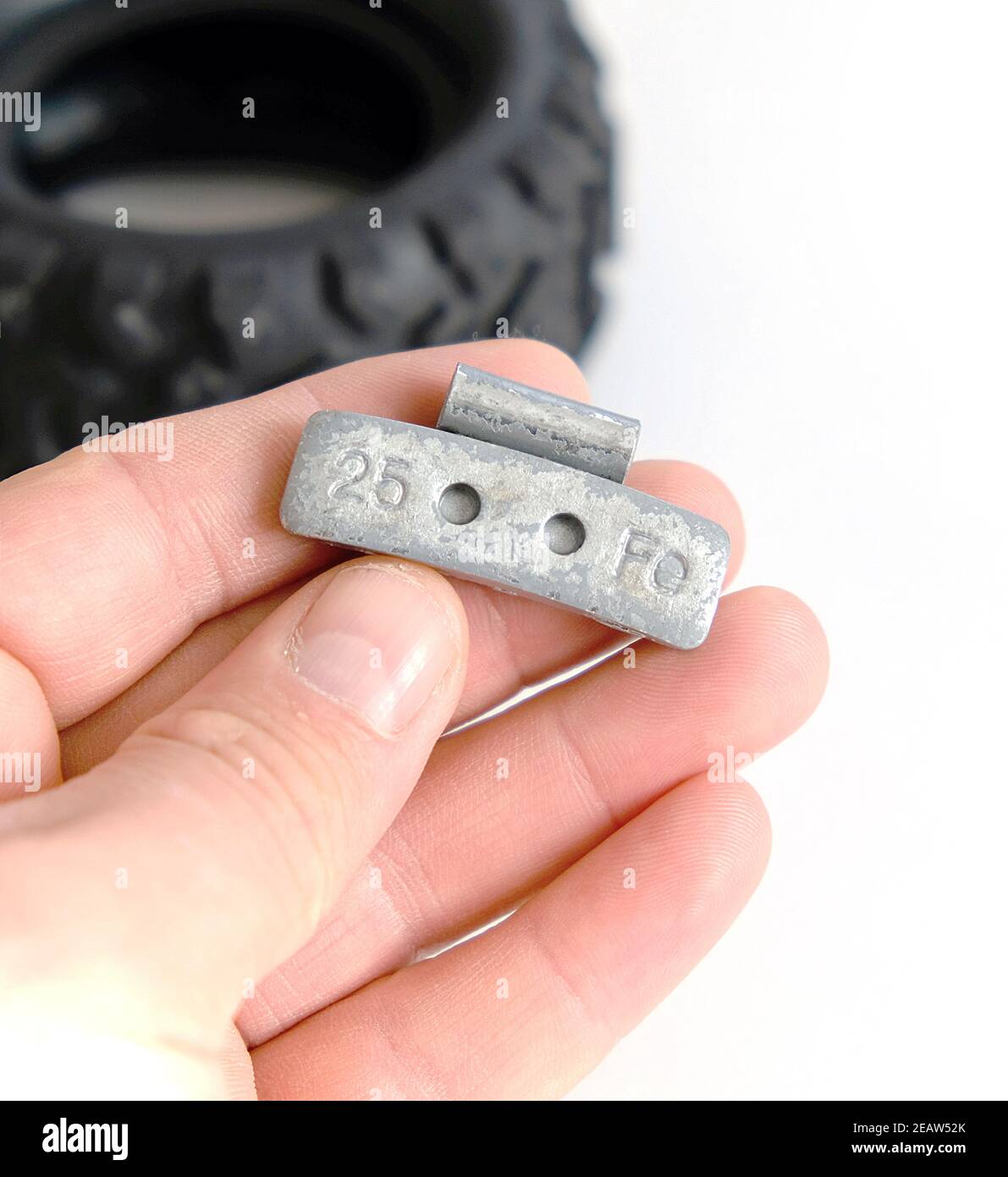 weight lead for automobile tire balancing on white ground, 25 gram