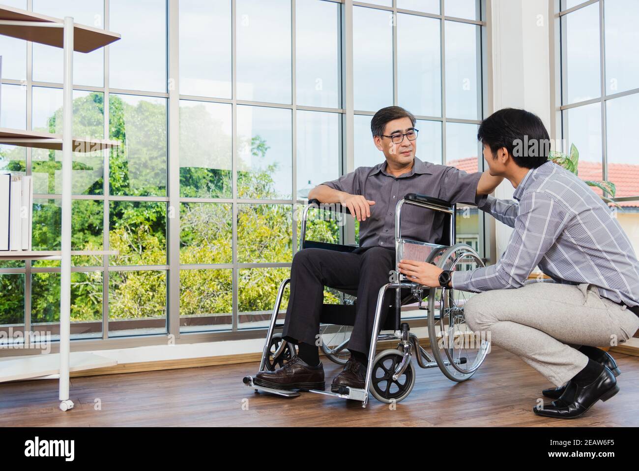 Old man in a wheelchair hi-res stock photography and images - Alamy