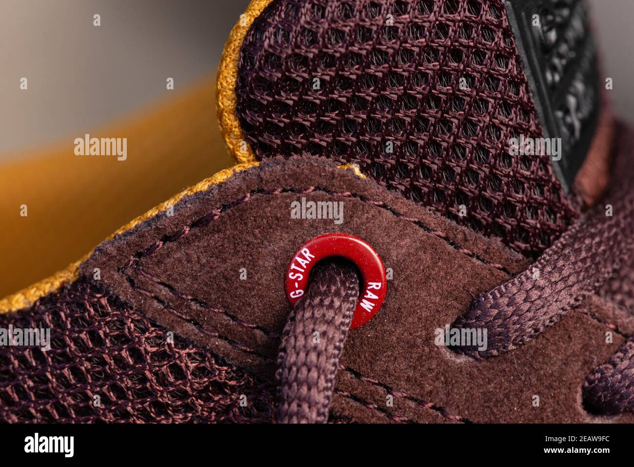 G-Star Raw branded red eyelet of casual burgundy men's shoes close up detail Stock Photo