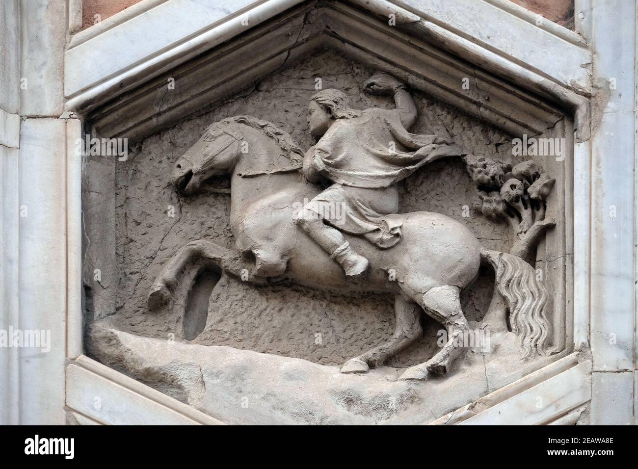 Allegory of Hunting from the workshop of Pisano, Relief on Giotto Campanile of Cattedrale di Santa Maria del Fiore (Cathedral of Saint Mary of the Flower), Florence, Italy Stock Photo