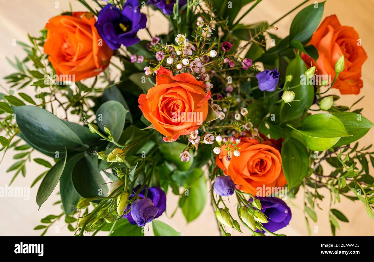 Close up of bouquet of flowers with orange roses Stock Photo