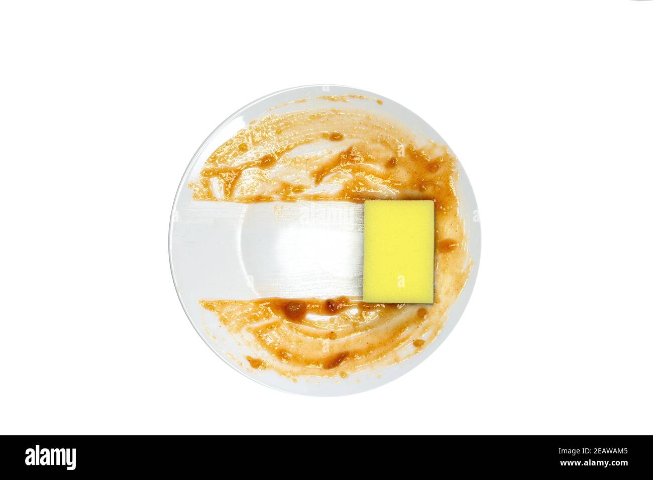 White round dirty plate with red sauce, yellow foam sponge cleaning