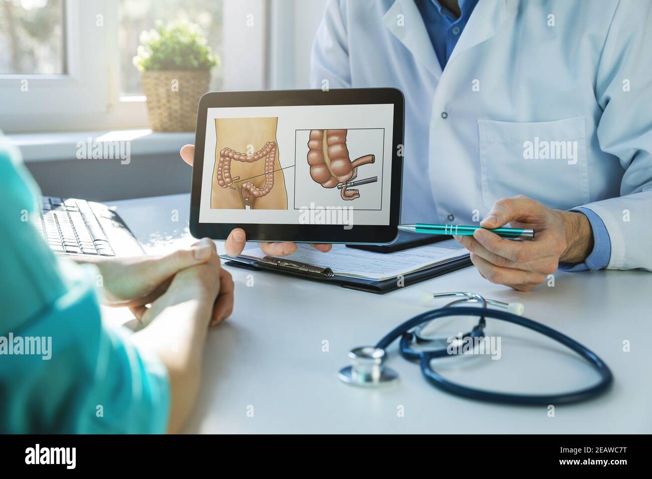 appendectomy - doctor and patient talking about planned appendix removal surgery in clinics office Stock Photo