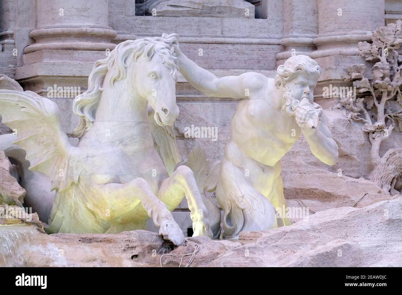 Triton and Winged Horse on the Trevi Fountain in Rome. Fontana di Trevi is one of the most famous landmark in Rome, Italy Stock Photo