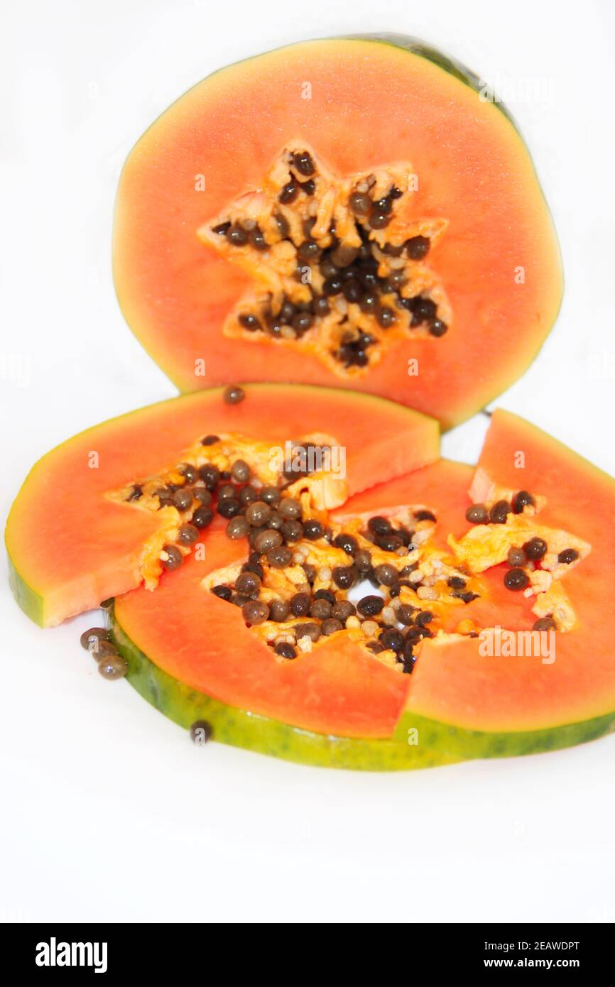 Cut papaya slice on white background. Ripe sweet fruits Stock Photo Alamy