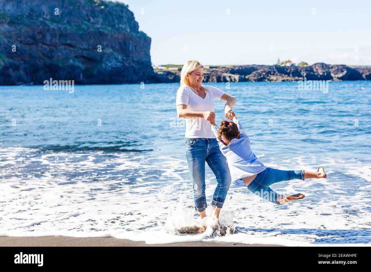 mom and daugther in spain Family holiday on Tenerife, Spain. Mother with daughter outdoors on ocean.  Portrait travel tourists - mom with daughter. Positive human emotions Stock  Photo - Alamy