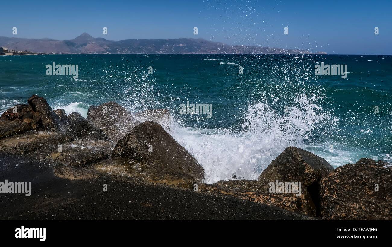 Ocean waves splashing on the coastal rocks Stock Photo - Alamy
