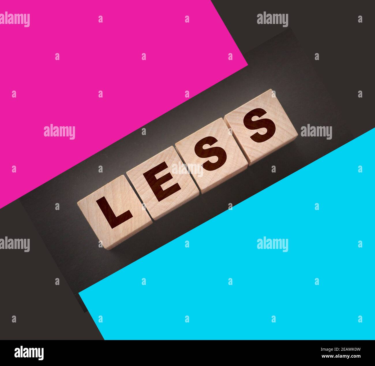 Less word on wooden cubic blocks. Spend less or cut costs business ...