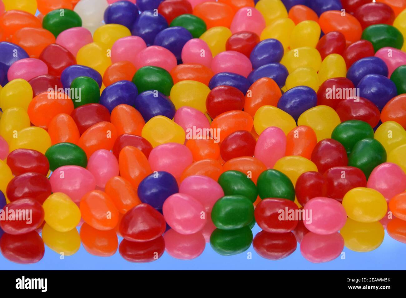 Colorful Jelly Beans On The Mirror With Its Reflection Against Blue Sky For Background Uses Top View 3 Dimension Stock Photo Alamy