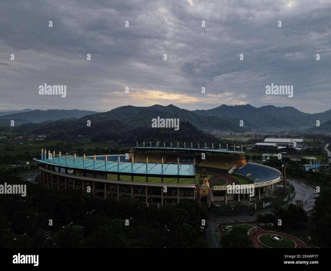Aerial view of football stadium in Bandung City, Indonesia. Sunset or sunrise and noise cloud