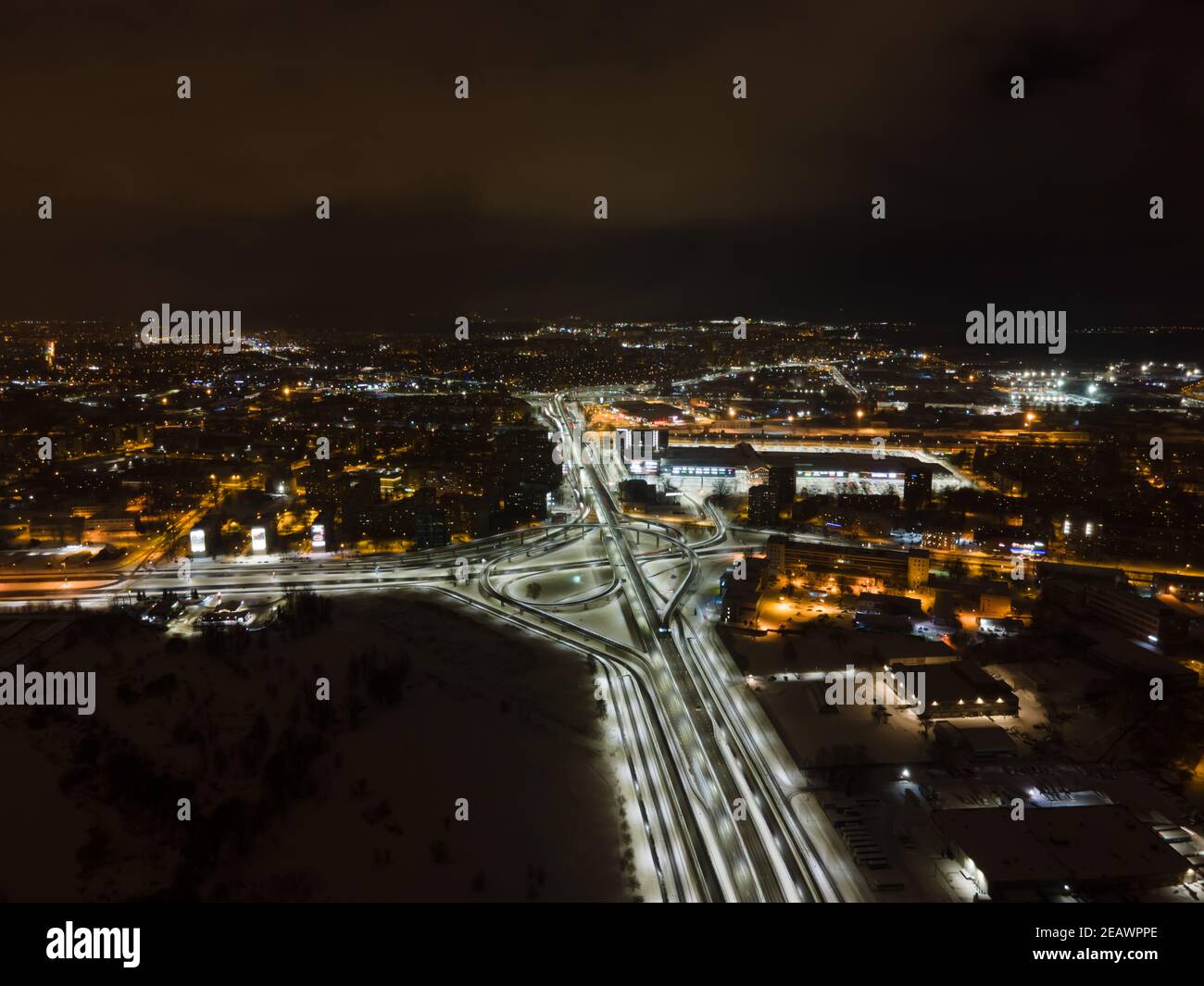 Aerial View Above of Busy Highway Road Junctions at Night. The