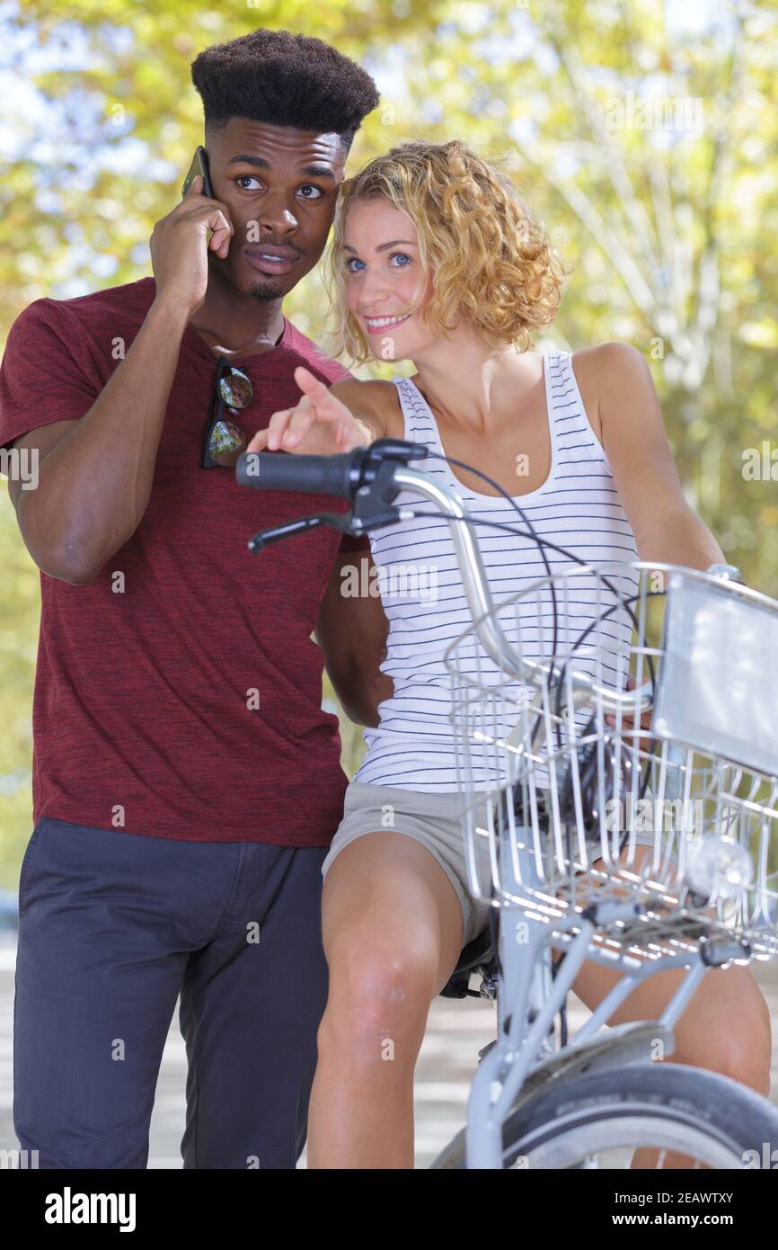 Multiracial young couple bicycle hi-res stock photography and images ...