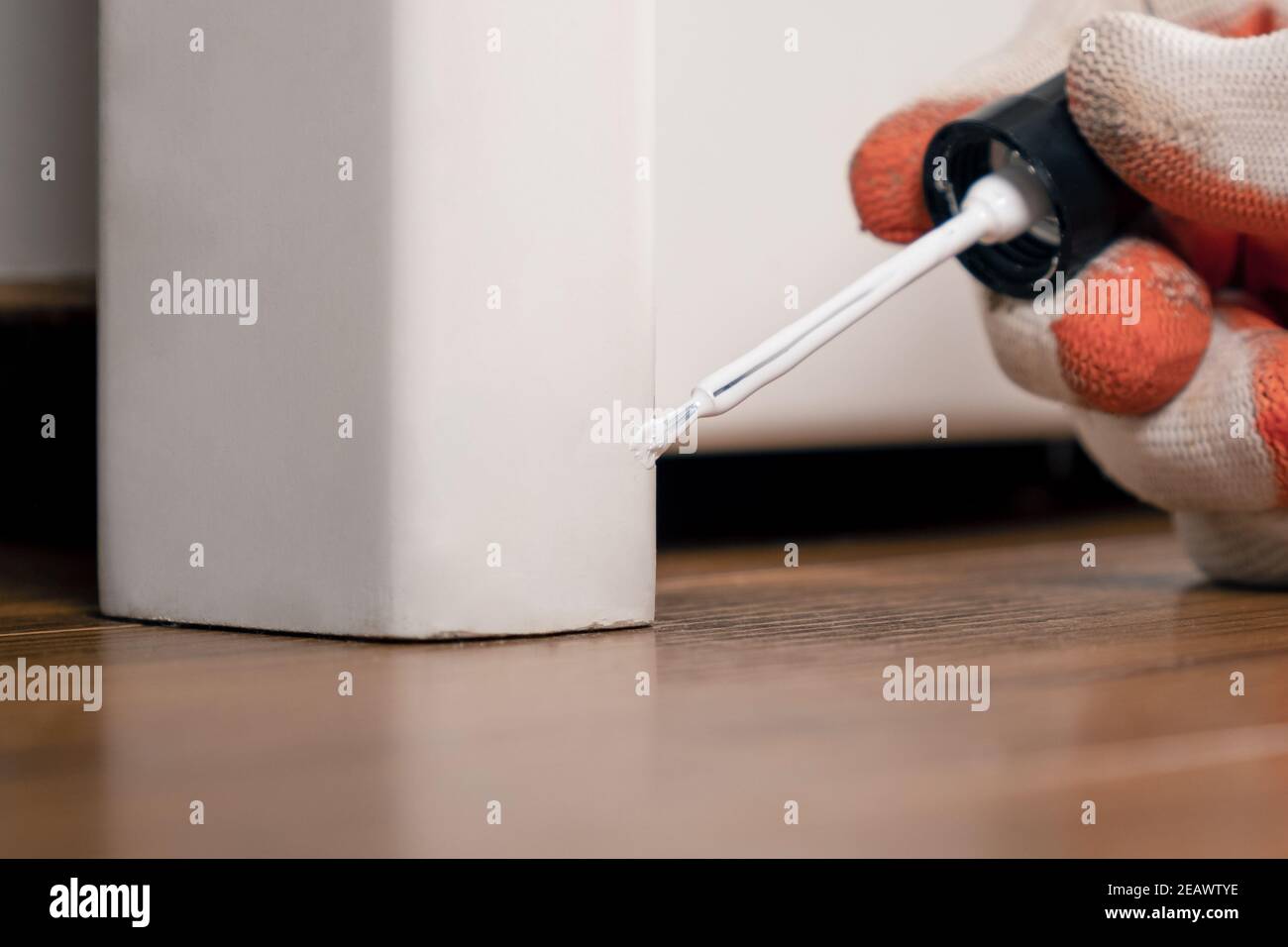touchup of chips on furniture, wood restoration Stock Photo Alamy
