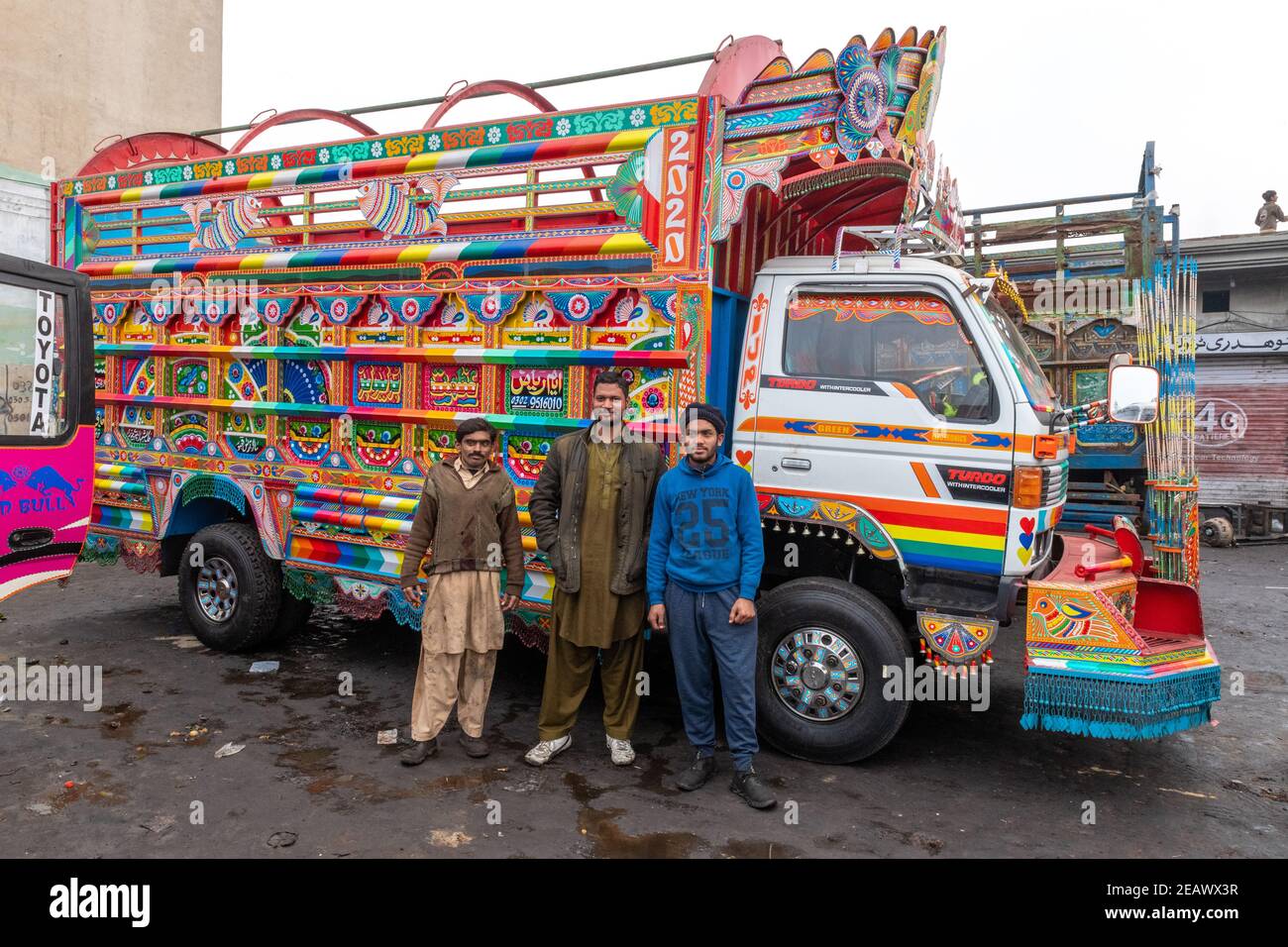 Workers at a truck art painting Lahore, Punjab, Pakistan