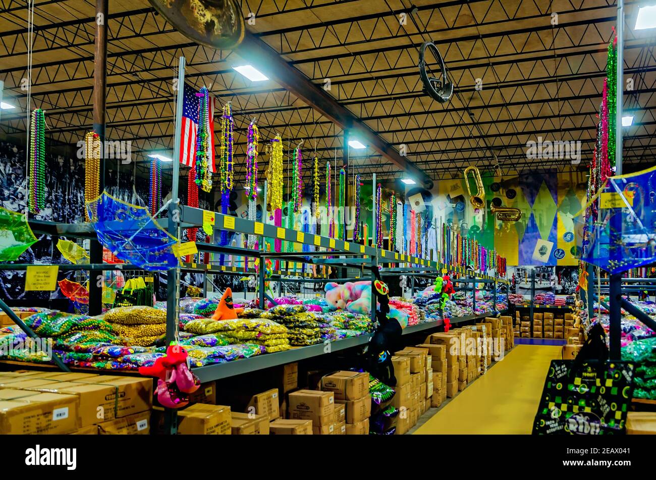 Mardi Gras beads line the shelves at Toomey’s Mardi Gras shop, Feb. 8