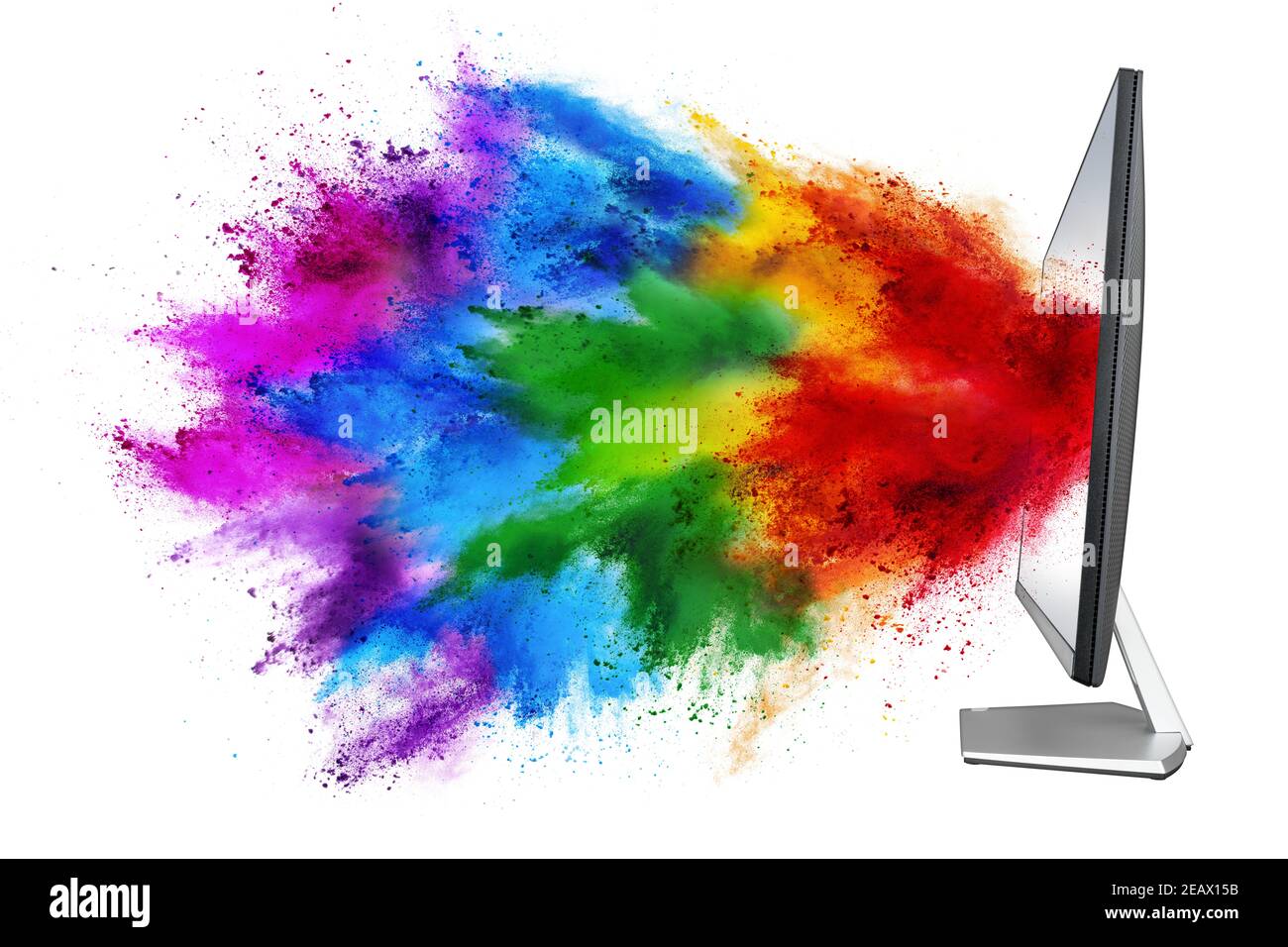 modern black silver pc computer monitor with colorful rainbow spray holi powder cloud explosion through flat screen isolated on white background. mult Stock Photo