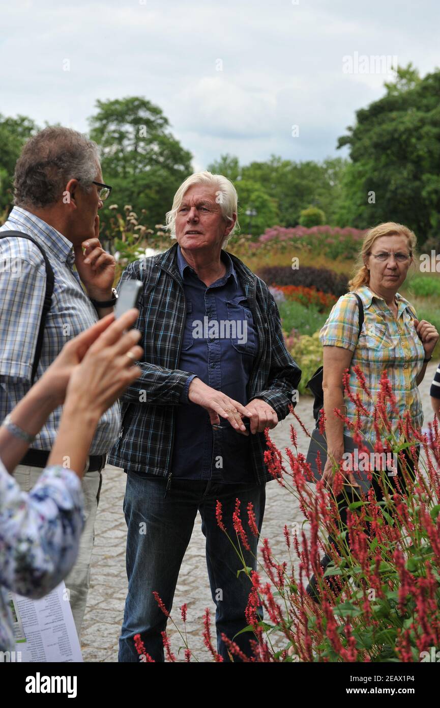 HAMM, GERMANY - 15 AUGUST 2015: Dutch garden designer Piet Oudolf leads an excursion over his plantings in a perennial meadow style in Maximilianpark Stock Photo