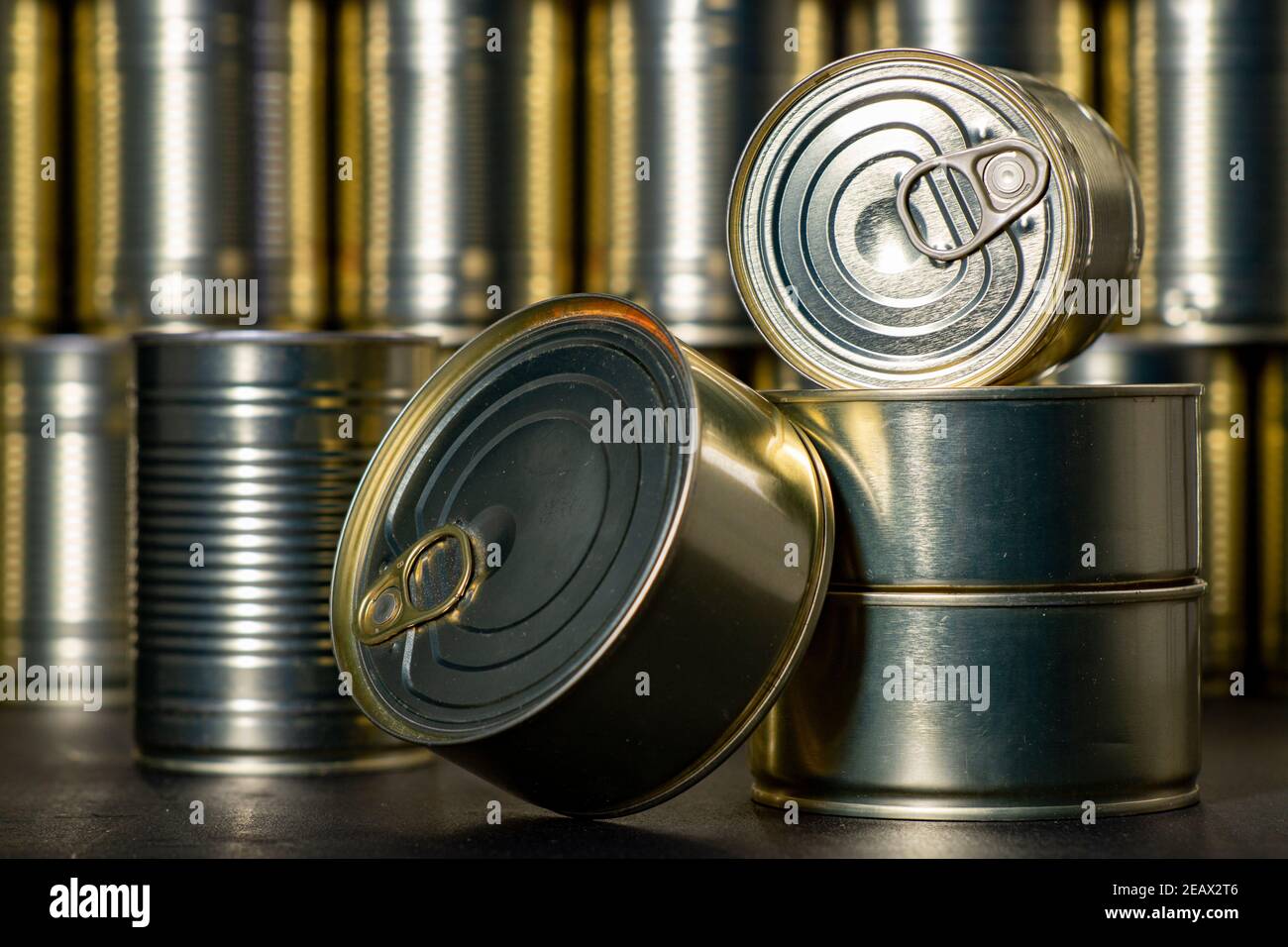 Metal cans with preserved meat. Food with a long shelf life. Dark