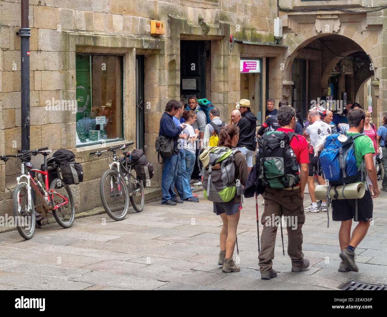 Pilgrims in front of the Pilgrim Office in Vilar Street at the end of their Camino - Santiago de Compostela, Galicia, Spain Stock Photo
