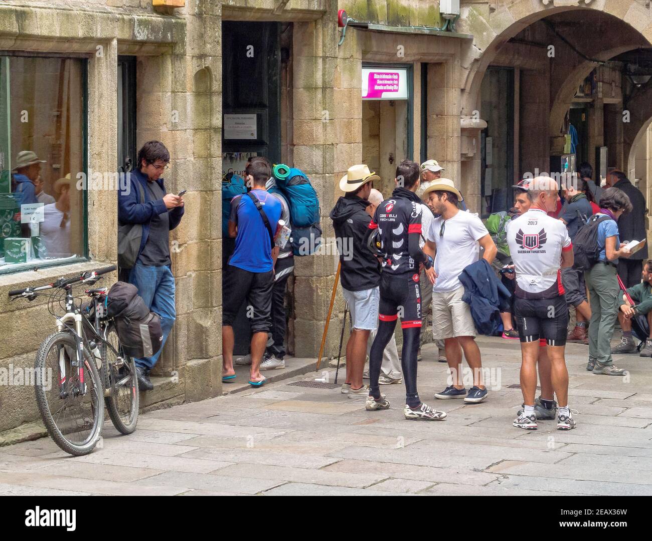 Pilgrims queue in front of the Pilgrim Office in Vilar Street at the end of their Camino - Santiago de Compostela, Galicia, Spain Stock Photo