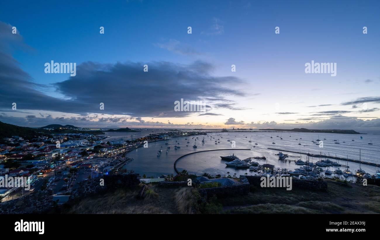 The harbour view at dusk from Fort Louis at Marigot, the French capital of St Martin in the Caribbean Stock Photo