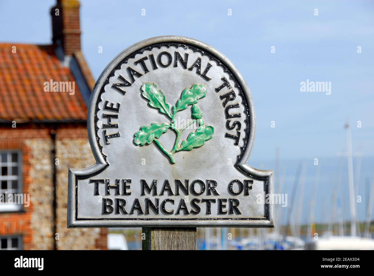 National Trust sign for the Manor of Brancaster, Norfolk, England Stock Photo