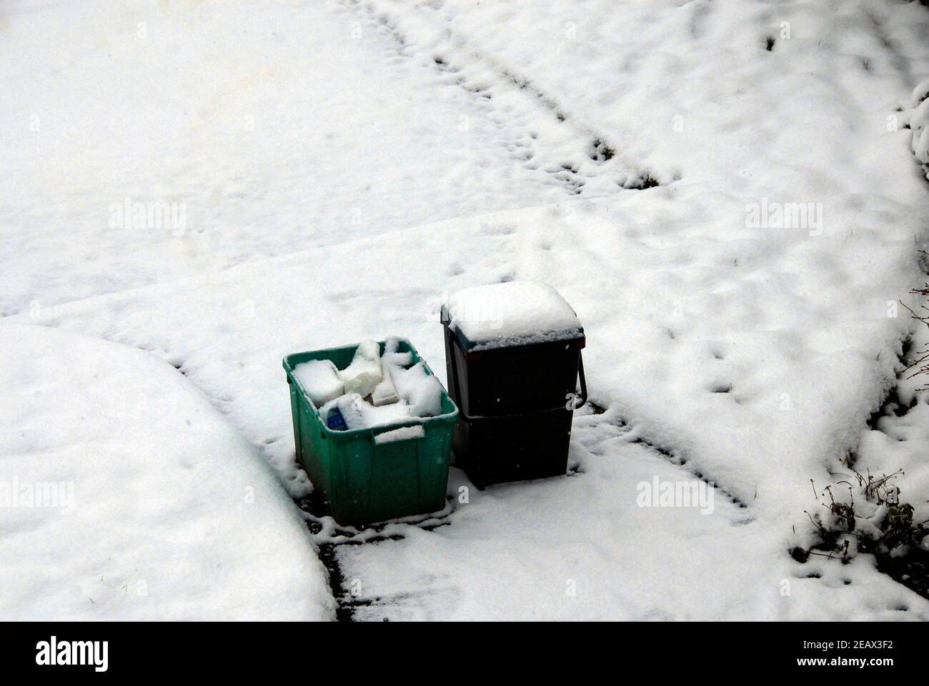 Material left out overnight for recycling in sub-zero conditions and snow Stock Photo