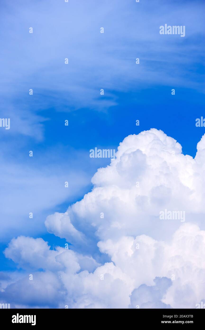 Big white cumulus cloud againts blue sky Stock Photo