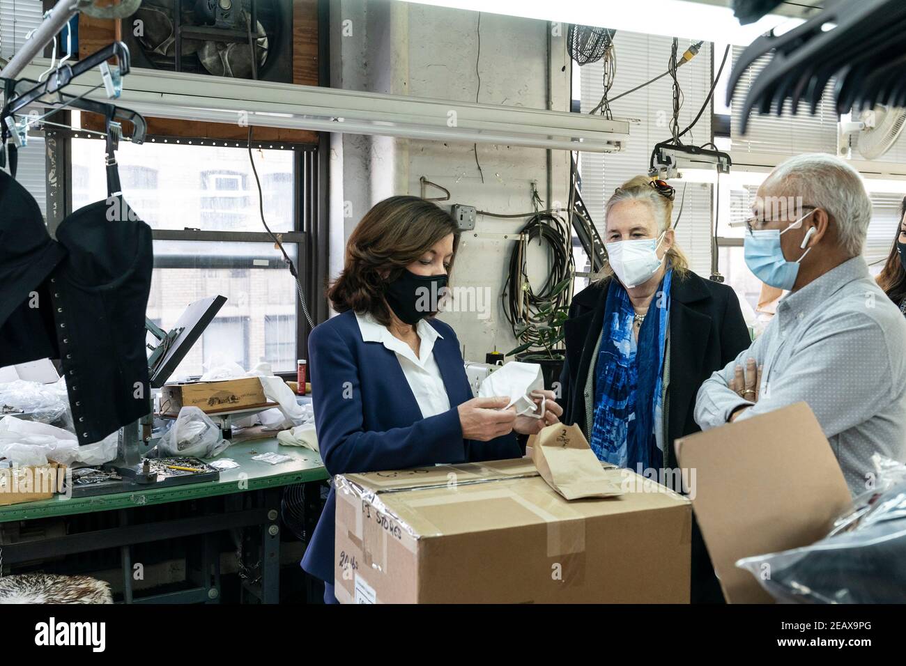 New York, United States. 10th Feb, 2021. LG Kathy Hochul visits Four Seasons Fashion as part of women-owned nonprofit Garment District for Gowns on 39th street of Manhattan in New York on February 10, 2021. LG was touring Four Season Fashion company owned by Tony Singh (R) and joined by Manhattan borough President Gail Brewer (2nd from right). (Photo by Lev Radin/Sipa USA) Credit: Sipa USA/Alamy Live News Stock Photo